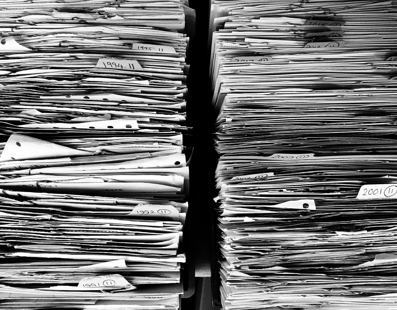 Organised office with neatly filed business documents, folders and systems in place